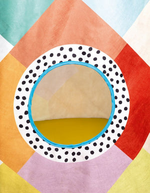Colorful geometric-patterned play tent on a white background
