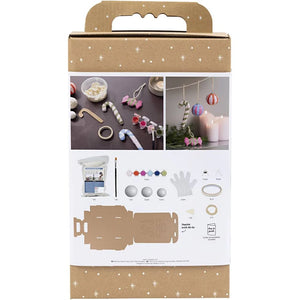 Craft kit packaging with images of craft items and tools on a white background