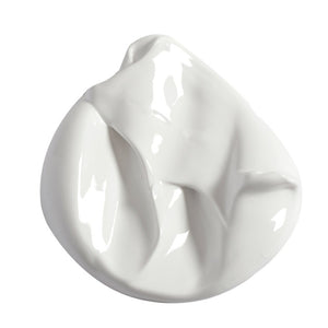 A white paint sample on a white background