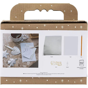 Cardboard packaging with cut-out windows showing craft materials and tools.