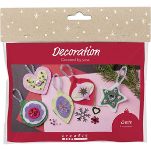 Packaged christmas craft decoration kitwith colorful ornaments on a red background