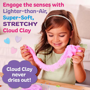 Child playing with pink Cloud Clay, a product that engages the senses.