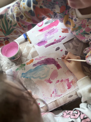two kids painting on white paper using the Create Watercolour Paint - 24 Paint Tin