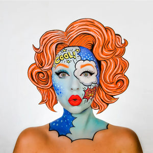 Person with colorful snazaroo face paint and hair on a white background