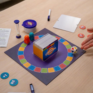 Board game setup with colorful components on a wooden table