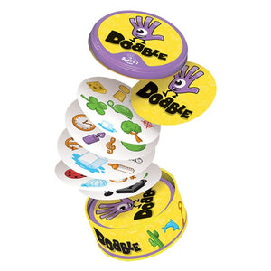 Stack of colorful 'Dooble' card game decks on a white background