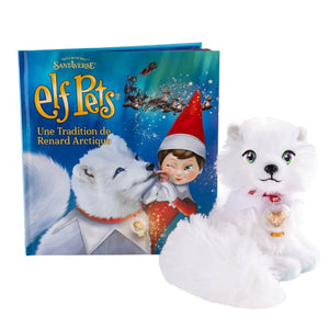The elf pets Arctic fox storybook next to the plush white fox toy on a white background