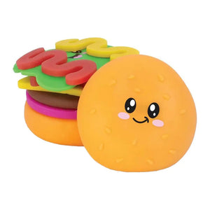 Colorful sensory toy resembling a sandwich with a smiling face on a white background