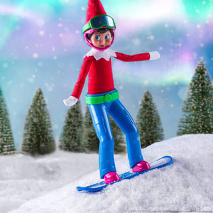 An elf scout riding the MagiFreez® - Snowboarder board in the snow with christmas trees and a snowy sky in the background