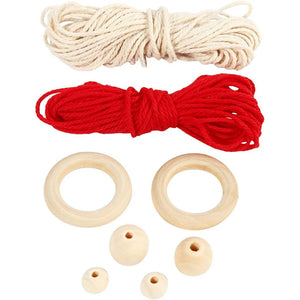 Red and beige Macramé wool with wooden rings and beads on a white background
