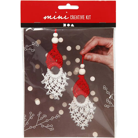 Packaged mini creative kit with red and white earrings on a brown background