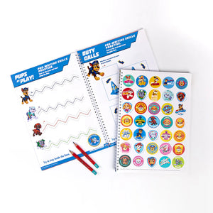 Paw Patrol activity book with stickers and pencils on a white background