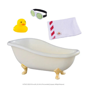 a white bathtub, a yellow rubber duck, a cucumber eyemask and an elf on the shelf towel on a white background