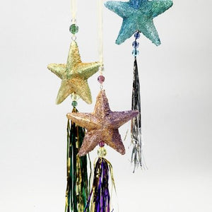 Decorative Polystyrene  hanging stars with tassels on a white background
