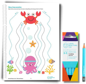 Children's activity book with a crab and octopus design, next to a pack of writing prompts and a pencil.