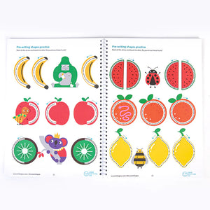 Educational book with colorful illustrations of fruits and animals on a white background