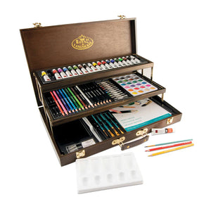 Art supply set with paints, brushes, and pencils in a wooden case on a white background