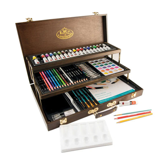 Art supply set with paints, brushes, and pencils in a wooden case on a white background