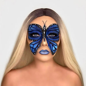 Person with blue butterfly face paint by snazaroo on a plain background