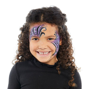 Child with halloween snazaroo face paint on a white background