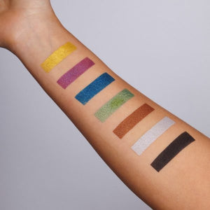 Snazaroo paint swatches on a person's arm with various shades of metallic colours.