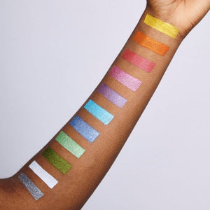 Snazaroo face paint swatches on a person's arm against a light gray background