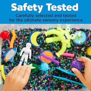 Colorful sensory play mat with various toys and a hand interacting with it, safety tested label above.